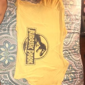 A yellow, cropped, jurassic Park t-shirt